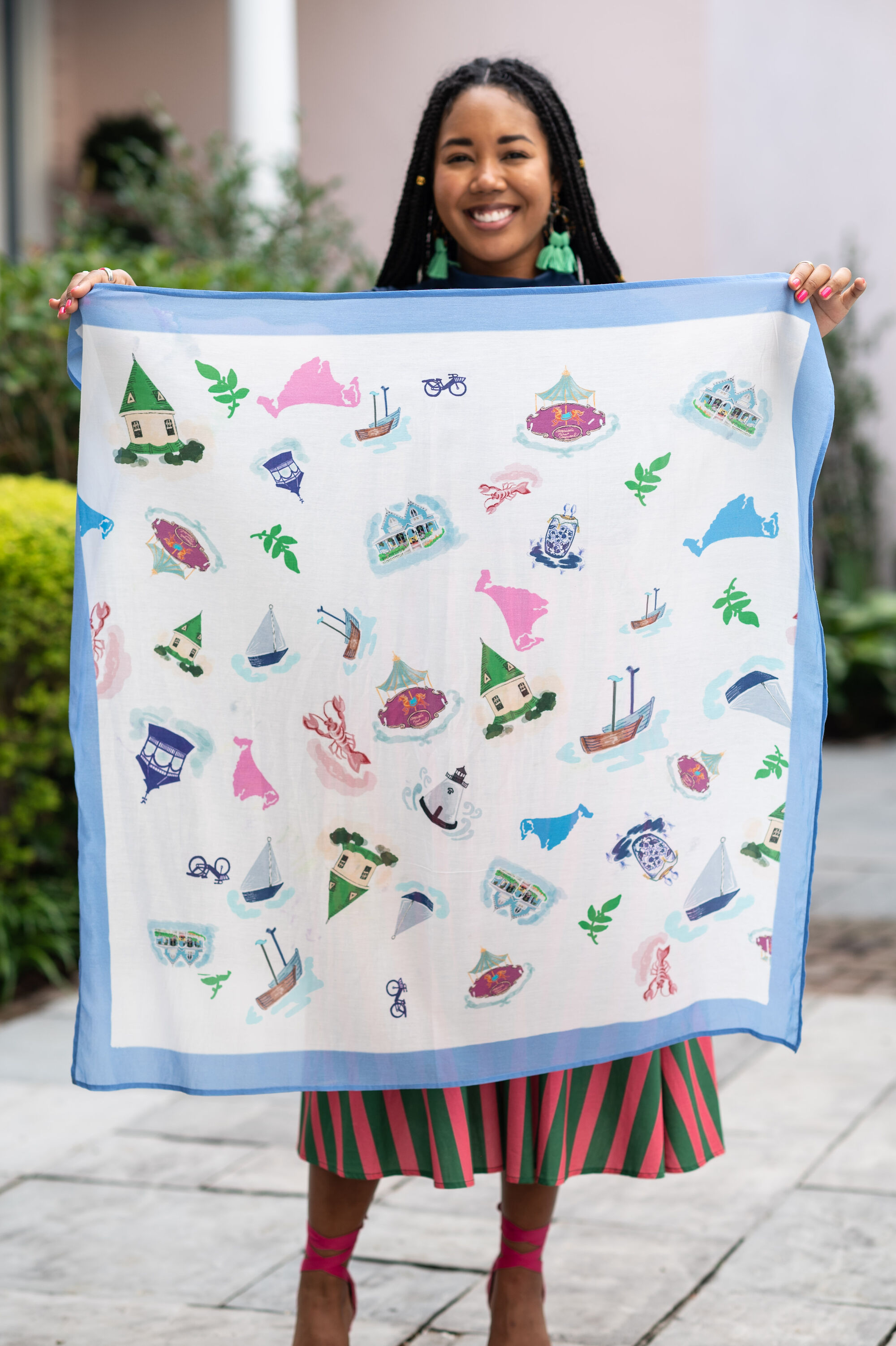 bright blue bow clutch against pink printed wrap skirt